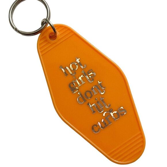 Orange Motel Room Keychain Holographic print says “hot girls don’t hit curbs” - Picture 1 of 7
